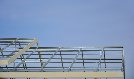 Home roof steel structure on blue sky background.