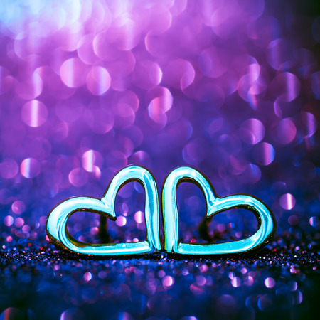 Heart ring on the floor with purple pastel bokeh on backgroundの写真素材