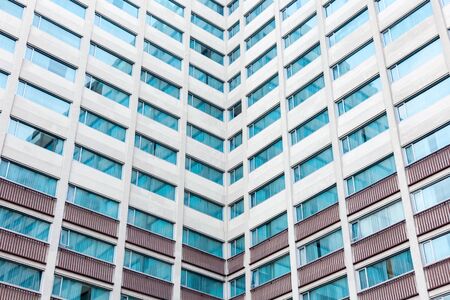 Multiple windows on a large office buildingの写真素材