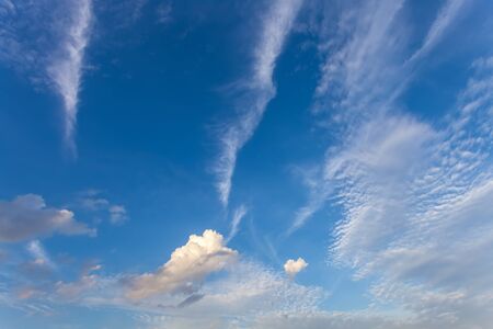 Blue sky with white fluffy clouds