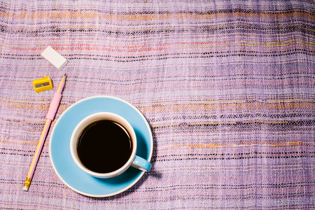 Black coffee put on floor, vintage stylized photoの写真素材