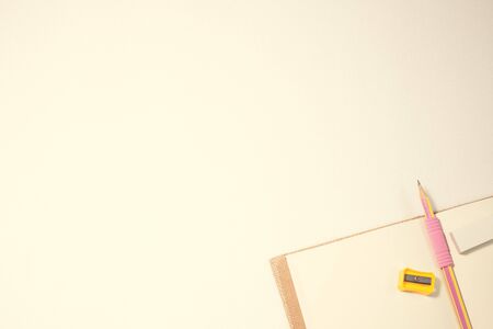 Notepad with office supplies for background, vintage stylized photoの写真素材