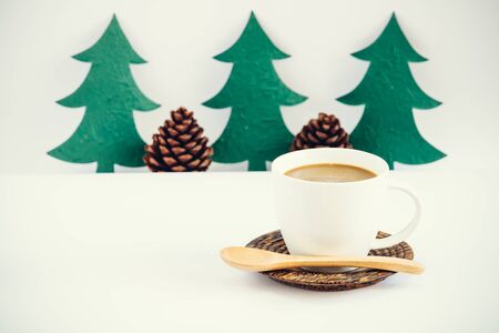Coffee cup with christmas decorate on white backgroundの写真素材