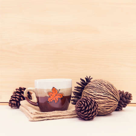 Christmas cup with pine on wooden table with copy space.の写真素材