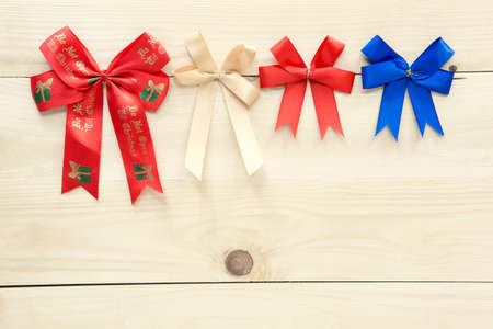 Christmas ribbons on wood background.の写真素材