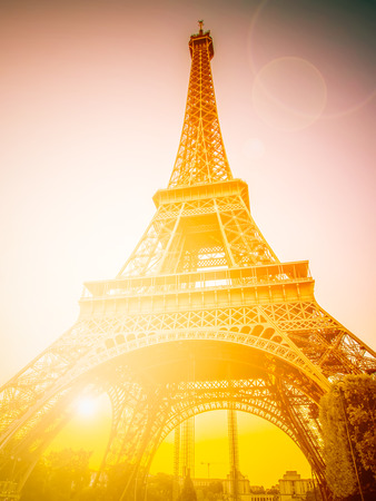The Eiffel tower, one of the most favorite landmarks in the world with sunlight. Retro filtered.の写真素材