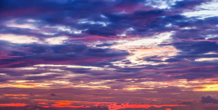 Dramatic sunset sky with clouds, beautiful natural background.