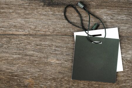 Price tag or label on old wooden table background.の写真素材