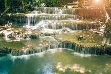 Landscape photo of beautiful waterfall in rainforest, Huay Mae Kamin Waterfall in Kanchanaburi, Thailand.の写真素材