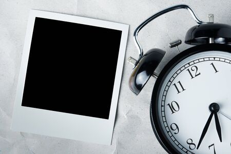 Photo frame and clock in black and white tone, vintage color filtered.