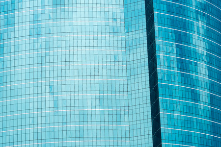 High building texture with reflex of sky and cloud.