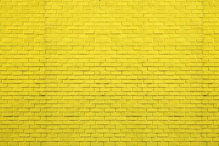 Yellow bricks pattern on wall for abstract background.