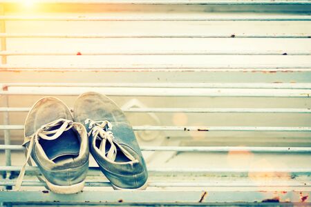 Shoes with summer sunset light for travel background.の写真素材