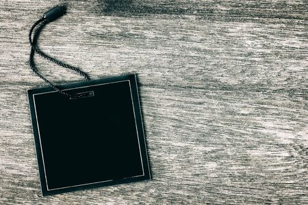 Price tag or label on old wooden table background.の写真素材