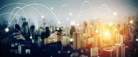 Businesswoman stand and look far away, high building, connection in Double exposure. Business concept. Vintage filtered.の写真素材