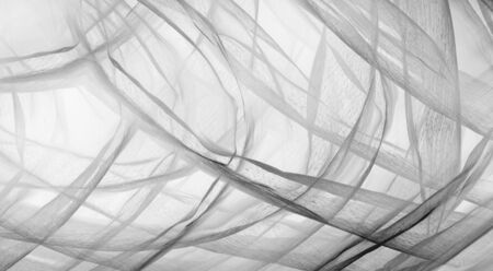 Soft focus of white fabric texture with light for abstract background.の写真素材