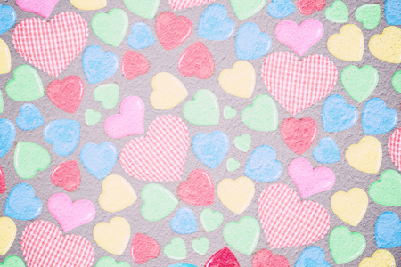 Double exposer of colorful hearts with paper texture for valentine and wedding background concept.