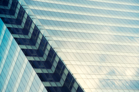 Architecture close up, windows of skyscraper. Glass and concrete. Urban landscape , City Business District. Modern abstract background. glass facades of modern of tall buildings and skyscraper.の写真素材