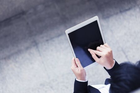 Closeup of business people working with tablet with free space.の写真素材