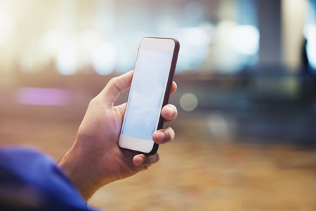 Modern connection technology concept. Businessman using smartphone or mobile to connect to people in city. E-commerce, online business.の写真素材