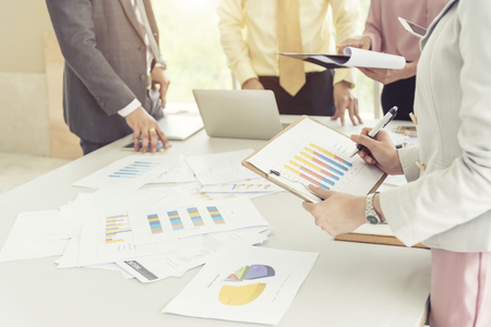Business meeting and job conference concept. Business people brainstorming about new project with information graph on table in office. Picture for add text message. Backdrop for design art work.の写真素材