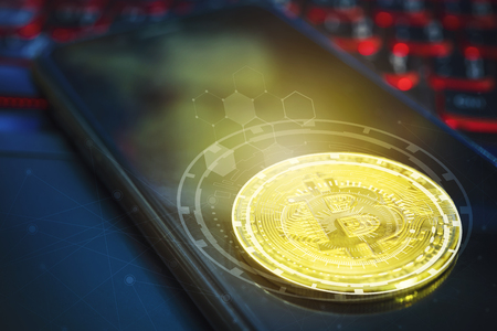 Bitcoin concept. Golden bitcoin on empty mobile screen on laptop with technology icons and free space background. Picture for add text message. Backdrop for design art work.の写真素材