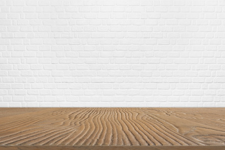 Abstract background from blank brown wood plank with white brick pattern on wall in background. Empty space for show product or advertising background. Picture for add text message, design art work.の写真素材