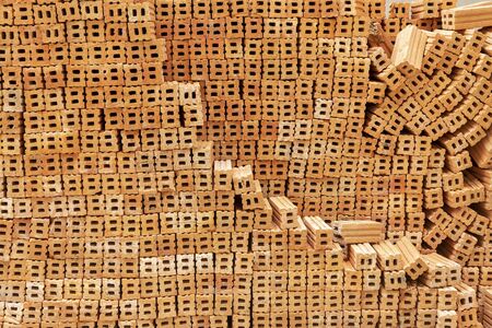 Pattern of stacked brown brick from abstract background. Building and construction backdrop.の写真素材