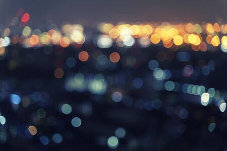 Abstract background from blurred bokeh light at night in the city.の写真素材