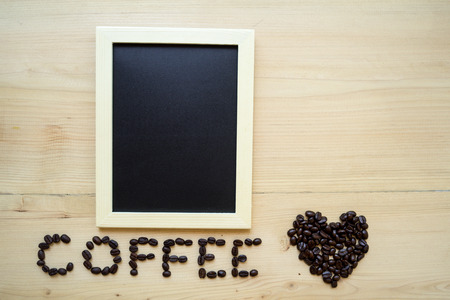 beans coffee on wood tableの写真素材