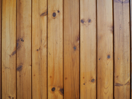 The wall of wood is vertical.