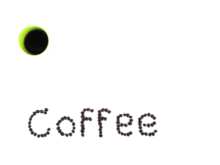 Coffee beans stacked on a white backdrop.の写真素材