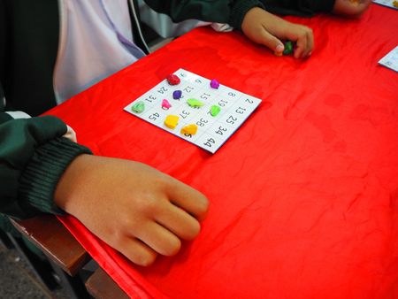 Teen hands And bingo boards.