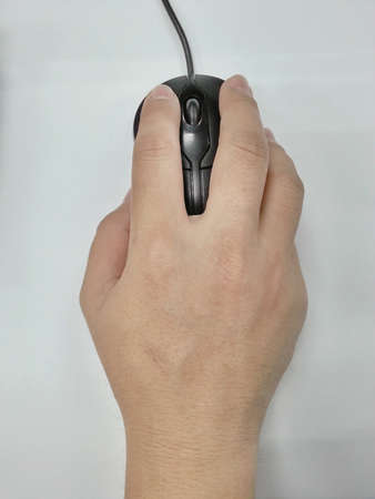 mouse in hand on white backgroundの写真素材