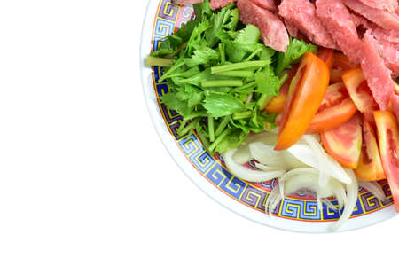 Colorful vegetables on the plate on a white background .の写真素材