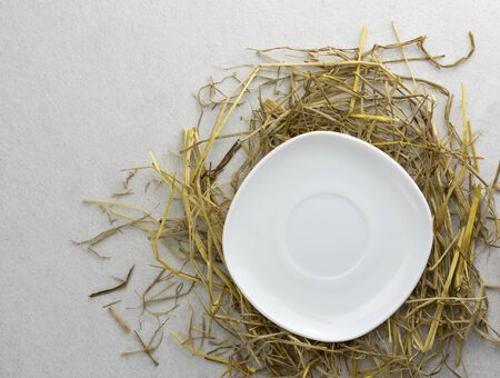 A plate on a straw isolated on a white backgroundの写真素材