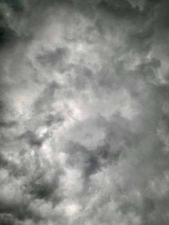 Black clouds formed before the rain, used for make a background image. Clouds become dark gray like...