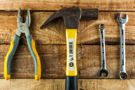 Mechanical tools on wooden background