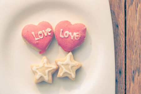 love cookies in white dish with vintage filter  effectの写真素材