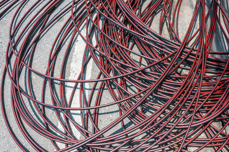 pile of cables on concrete road