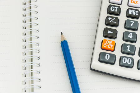 pencil   calculator on notebook, concept for office workの写真素材