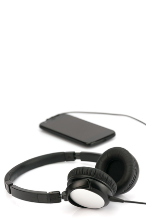 Smart phone with headphone on white backgroundの写真素材