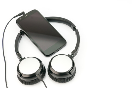 Smart phone with headphone on white backgroundの写真素材