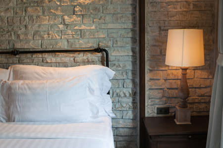 Bedroom interior, close up at pillow & lampの写真素材