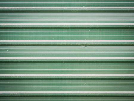 Grunge green metal sheet wall background.の写真素材