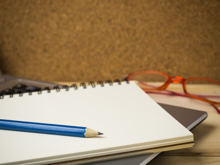 Pencil and notebook on laptop for business concept.の写真素材