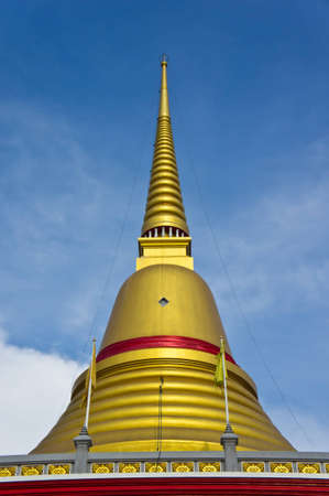 golden pagoda at temple in samutprakan, thailandの写真素材