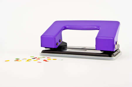 purple paper puncher or paper driller isolated on whiteの写真素材