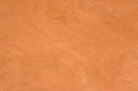 background: brown clay wall and floor