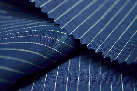 close up dark blue fabric of suit, photoshoot by depth of field for objectの写真素材